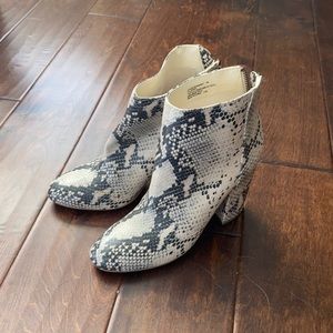 Snake skin high heeled booties
